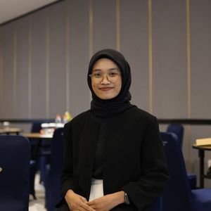 Portrait of Olga Zarichna smiling professionally